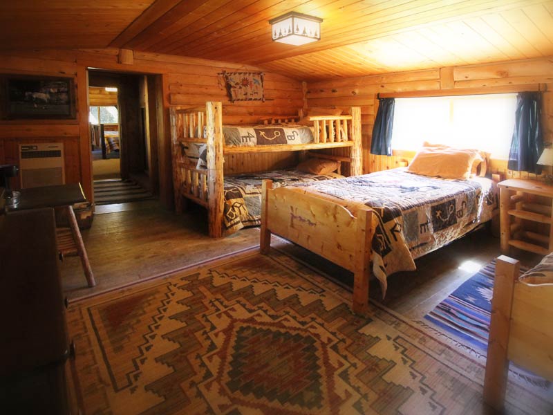 cabin with a bunk and a bed