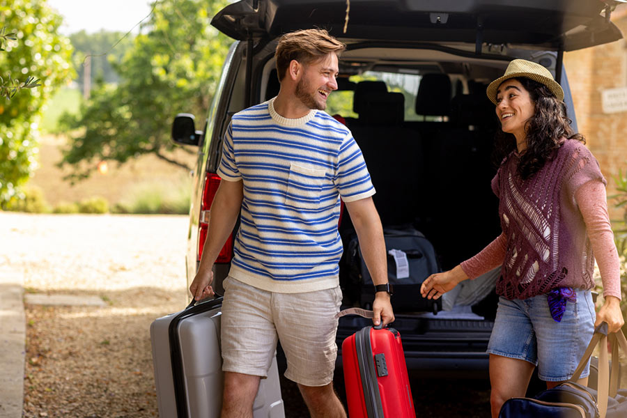 couple unloading rental car