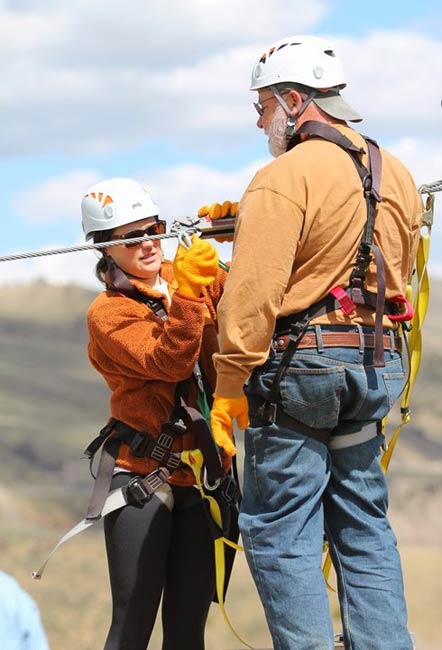 man getting ready for zip line