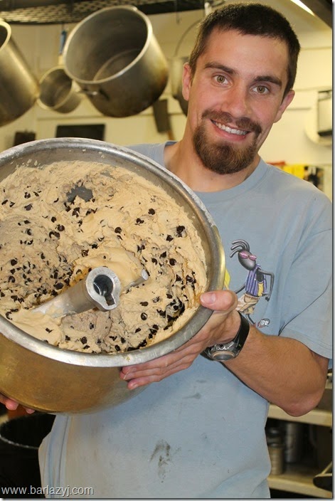 man holding mixer with cookie dough